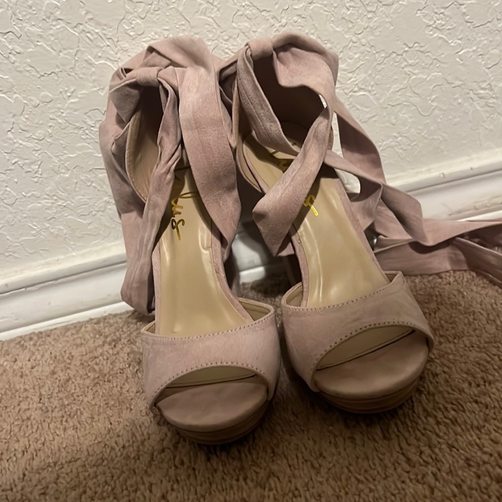Pretty much new heels. Worn once for two hours but we’re to big for me.